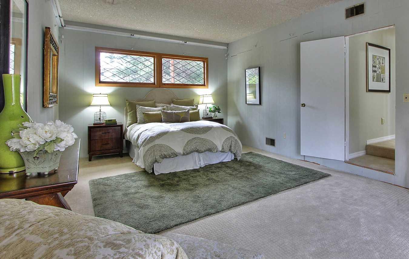 35 Selby Lane Atherton, CA 94027 - Photo 23 of 30 a bedroom with bed and a window