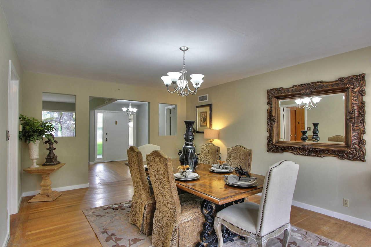 35 Selby Lane Atherton, CA 94027 - Photo 7 of 30 a dining room with wooden floor a chandelier a wooden table and chairs