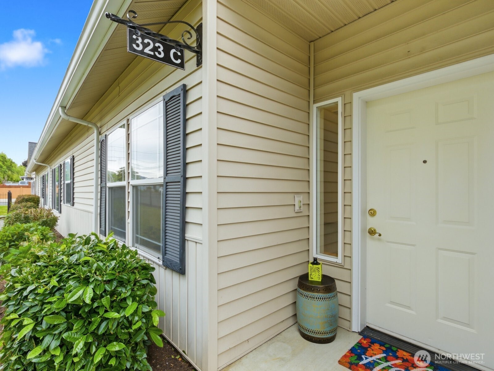 323 North Laventure Road, Unit C Mount Vernon, WA 98273 - Photo 3 of 24 a view of a street with potted plants