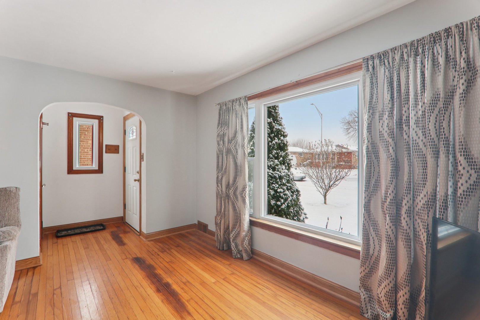 8033 Austin Avenue Burbank, IL 60459 - Photo 5 of 19 a view of front door with wooden floor