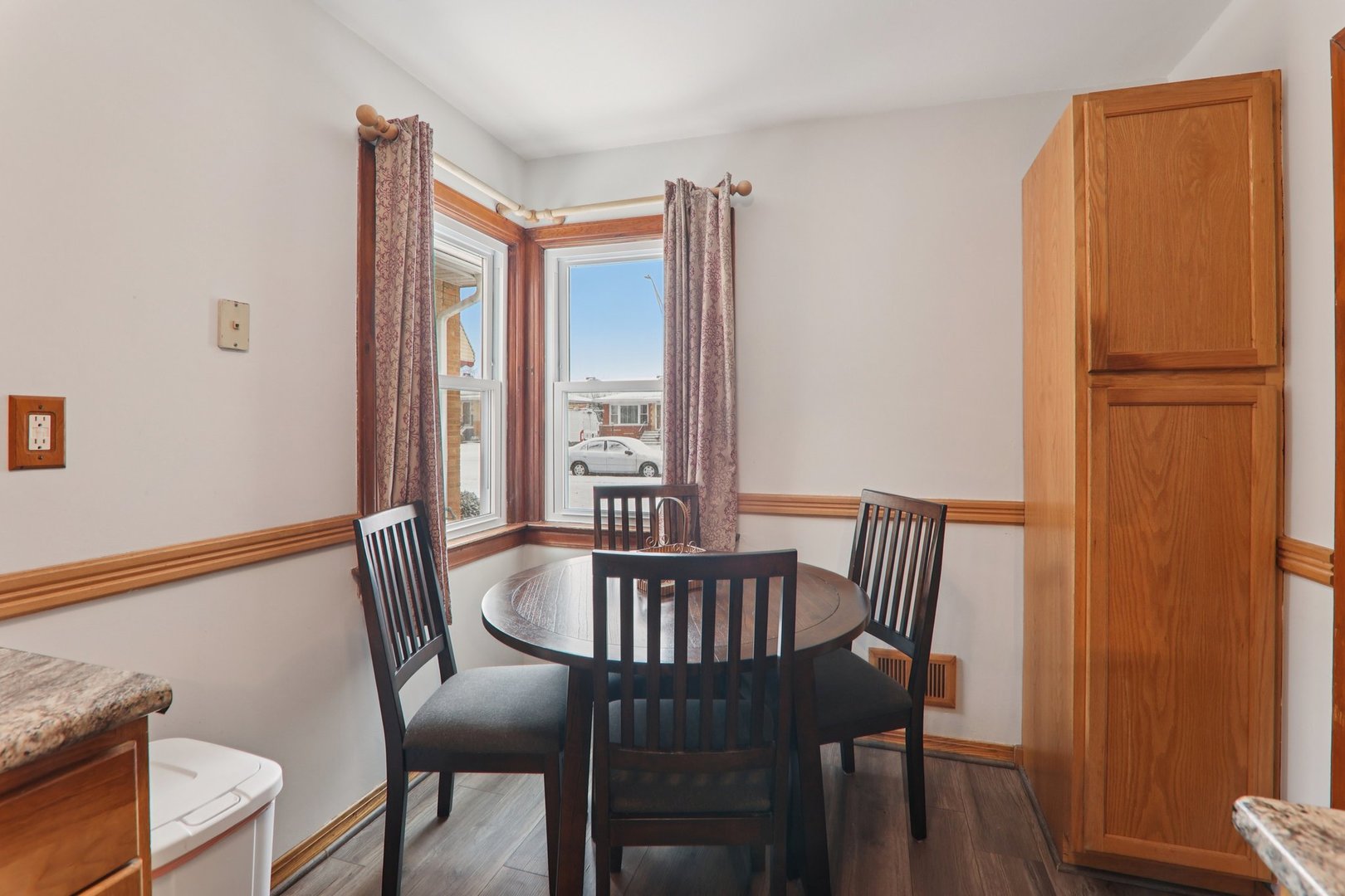 8033 Austin Avenue Burbank, IL 60459 - Photo 8 of 19 a view of a dining room with furniture window and wooden floor