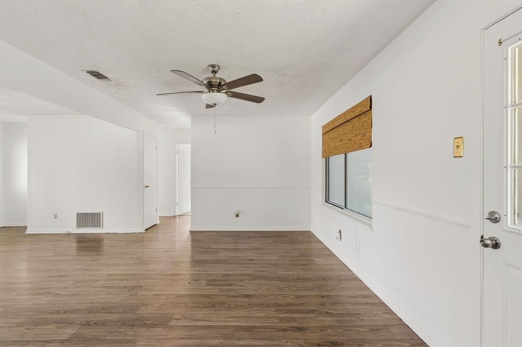 1822 Finley Road Irving, TX 75062 - Photo 14 of 38 a view of empty room with wooden floor