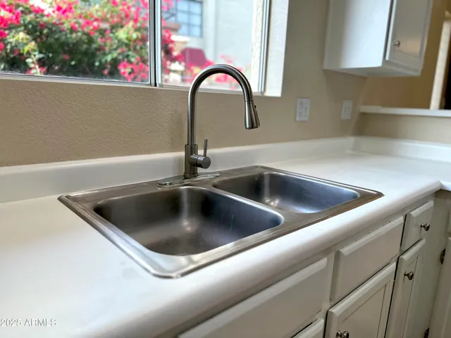 a stove top oven sitting inside of a kitchen