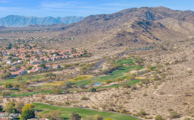 a view of a city with mountains in the background