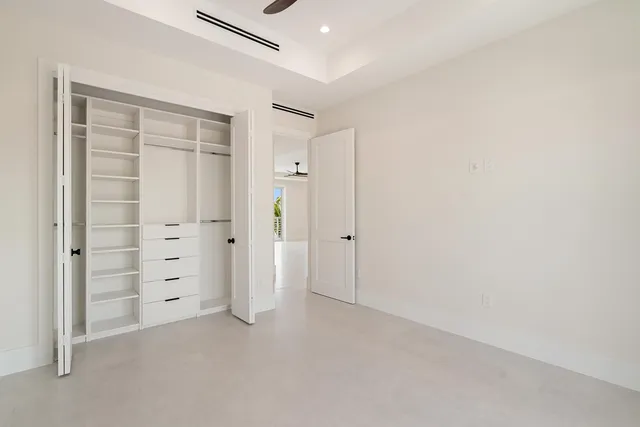 a bathroom with double vanity sinks and a mirror