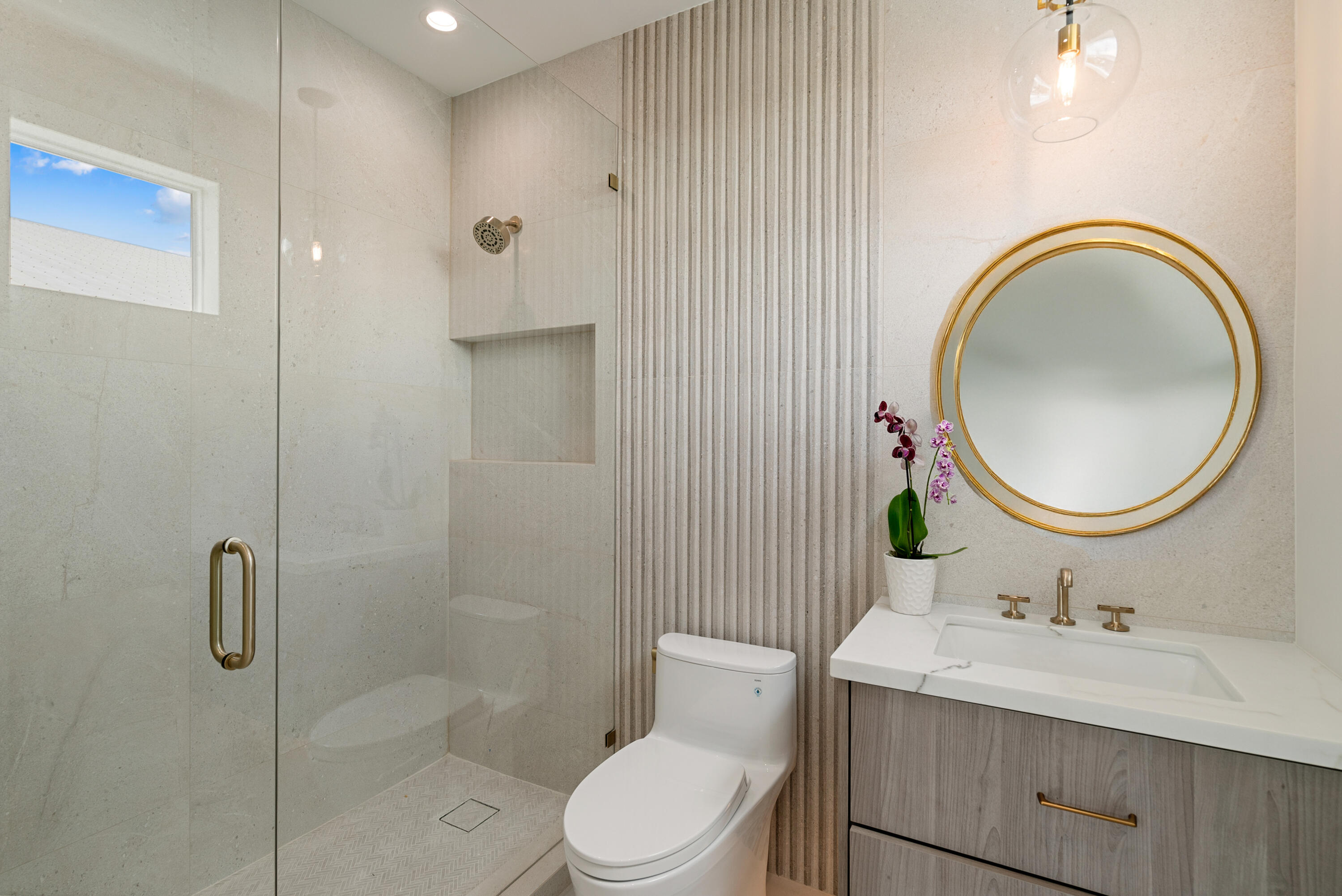 206 Plantation Avenue Tavernier, FL 33070 - Photo 22 of 81 a bathroom with a toilet a sink a mirror and vanity