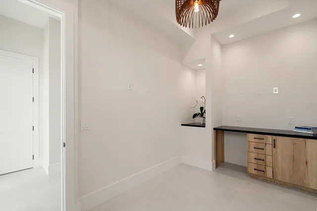 an aerial view of multiple houses and a yard