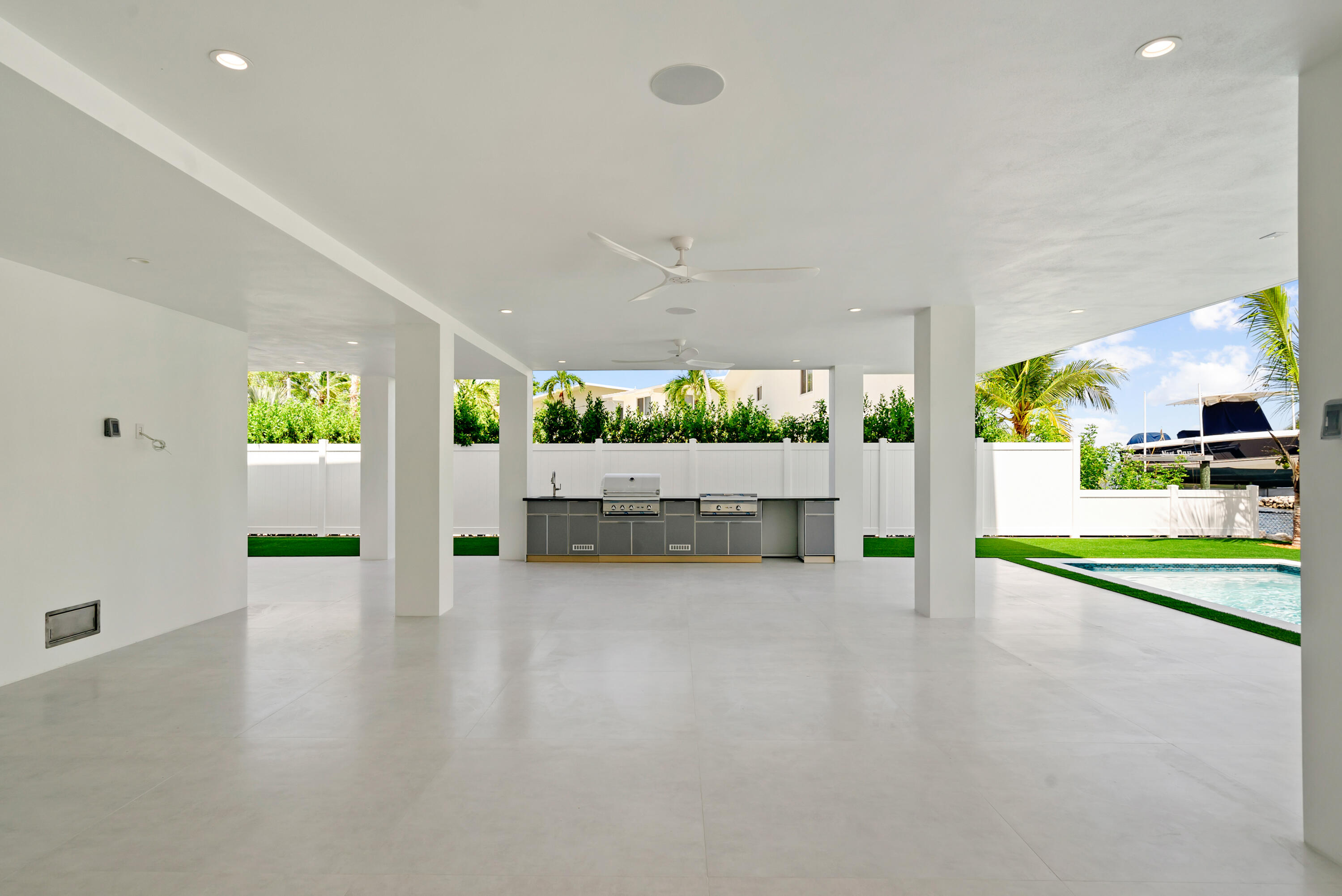 206 Plantation Avenue Tavernier, FL 33070 - Photo 44 of 81 a view of an empty room with a window and kitchen view