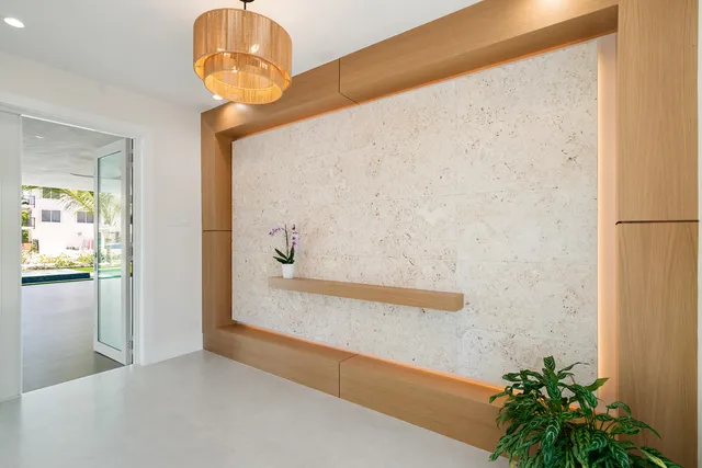 a kitchen that has a sink a stove and cabinets