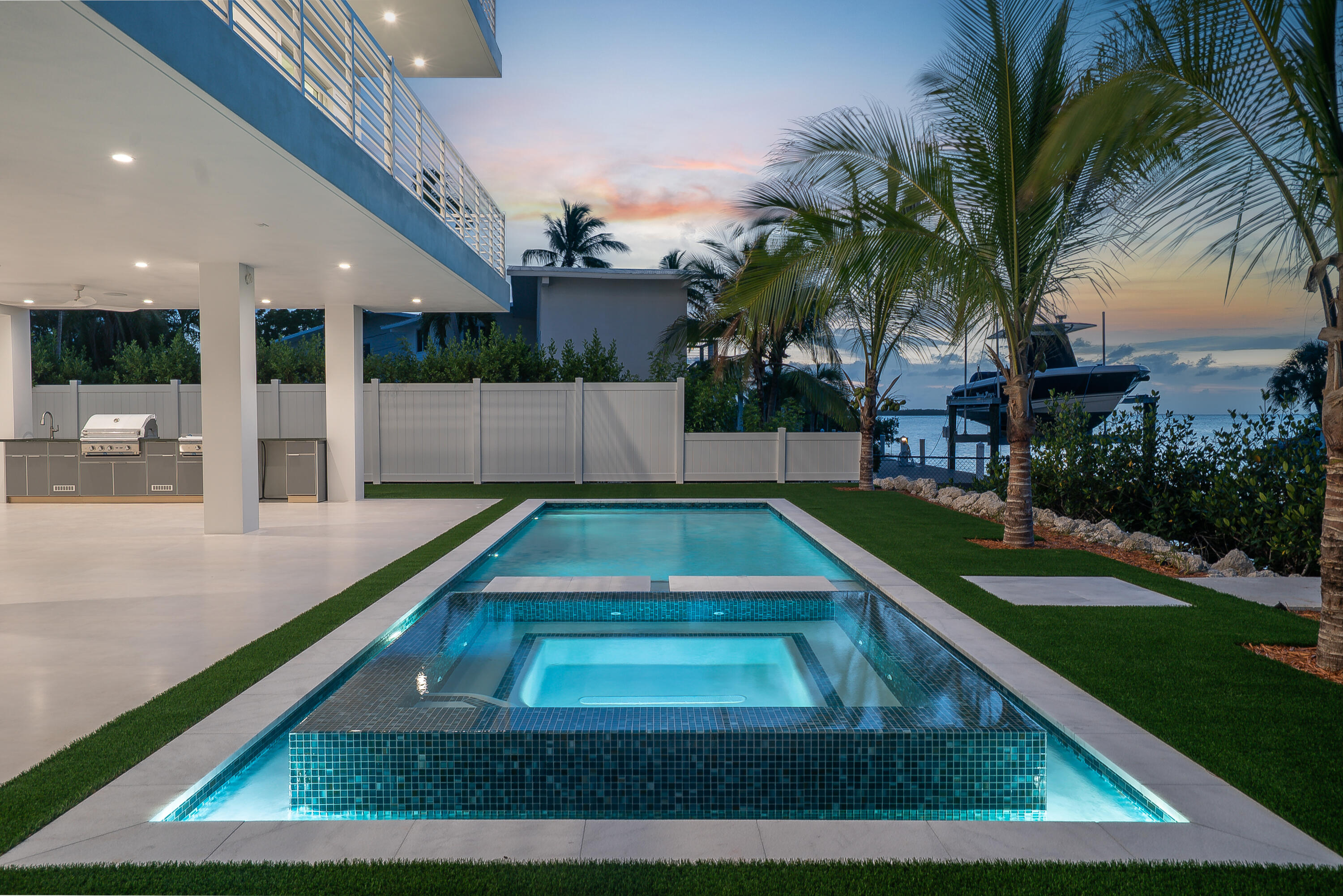 206 Plantation Avenue Tavernier, FL 33070 - Photo 58 of 81 a view of a swimming pool with a patio and a yard