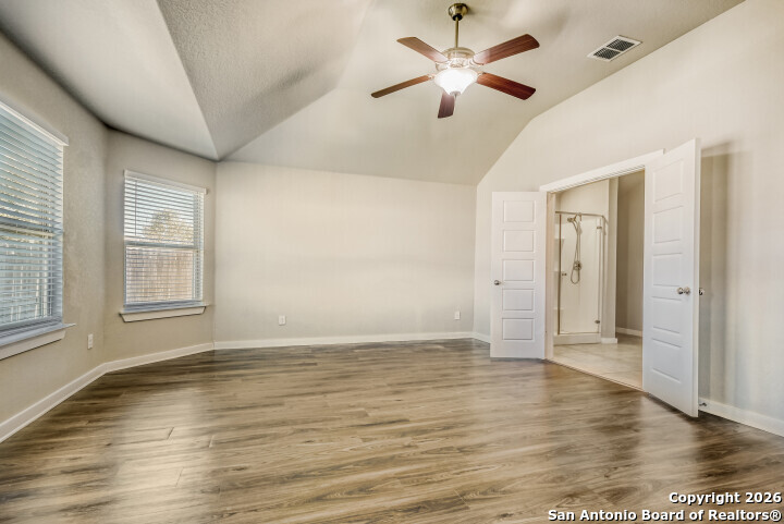 10583 Penelope Way Converse, TX 78109 - Photo 13 of 26 wooden floor in an empty room with a window