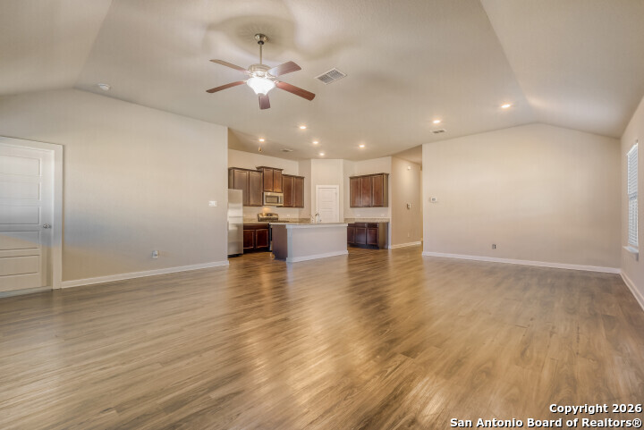 10583 Penelope Way Converse, TX 78109 - Photo 8 of 26 a view of kitchen and hall with wooden floor