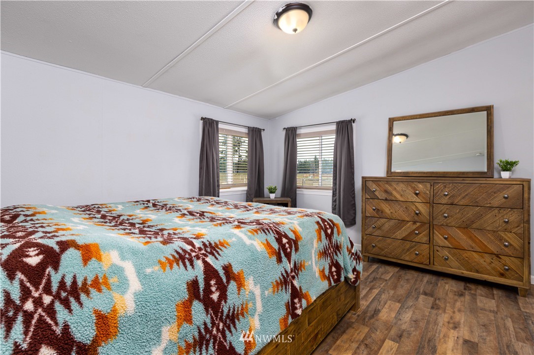 18108 Lawton Lane Southwest Rochester, WA 98579 - Photo 5 of 13 a bedroom with a bed and a dresser