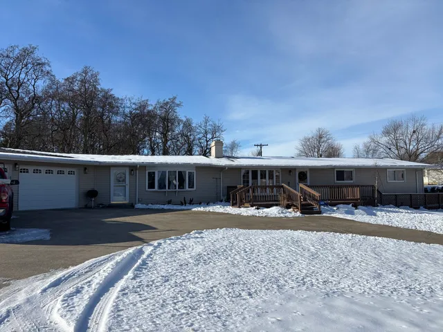 a view of house with backyard and seating space