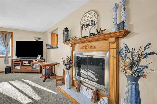 a large kitchen with stainless steel appliances granite countertop a sink and cabinets