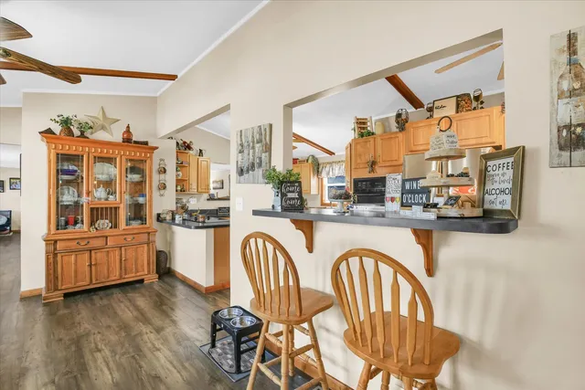 a kitchen with stainless steel appliances granite countertop a sink and cabinets