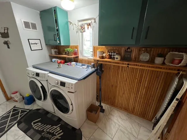 a utility room with dryer and washer