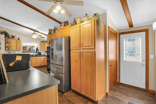 a bathroom with a sink a mirror a shower and a mirror