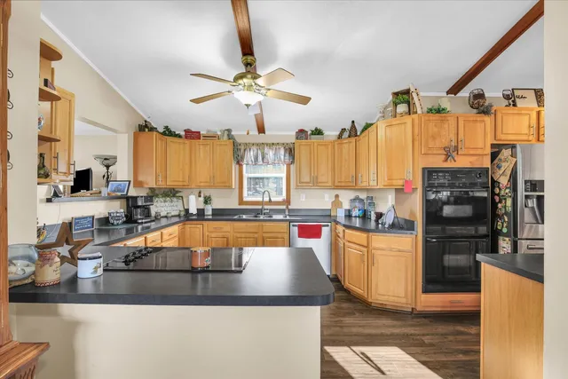 a bathroom with a double vanity sink toilet and shower
