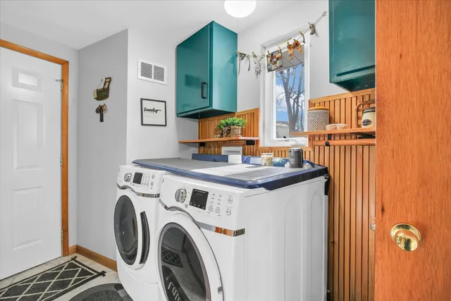 a bedroom with a bunk bed and a dresser