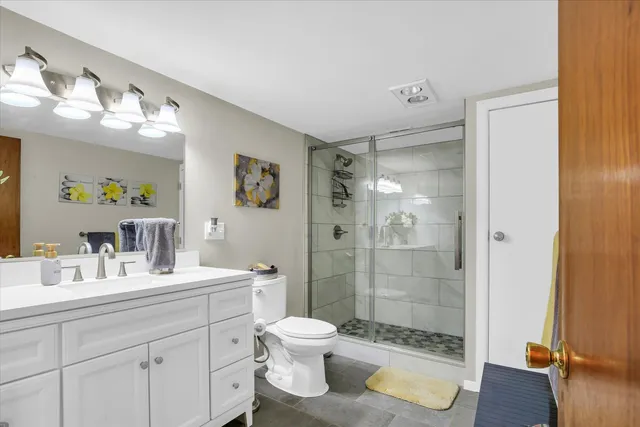 a bedroom with a bed and a flat tv screen