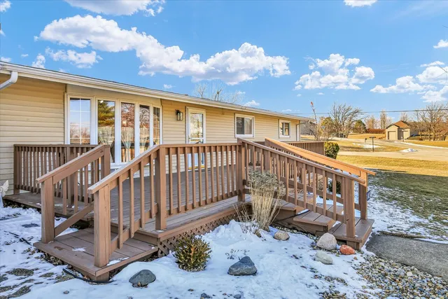 a view of outdoor space with deck and large trees
