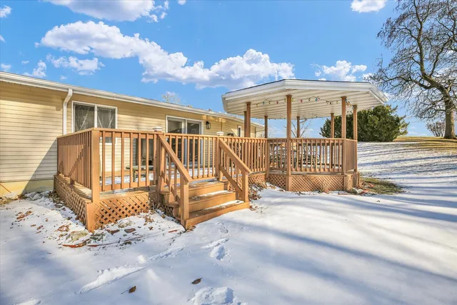 a view of a house with backyard porch and sitting area