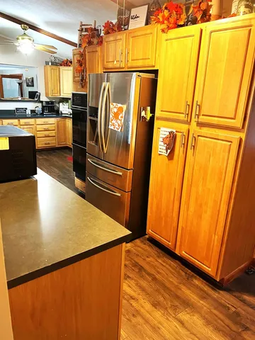 a view of a refrigerator with kitchen island