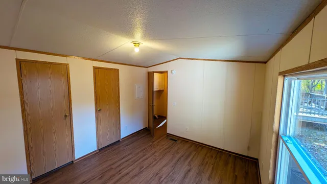 a view of hallway with wooden floor