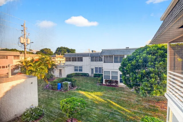 a view of hallway with wooden floor