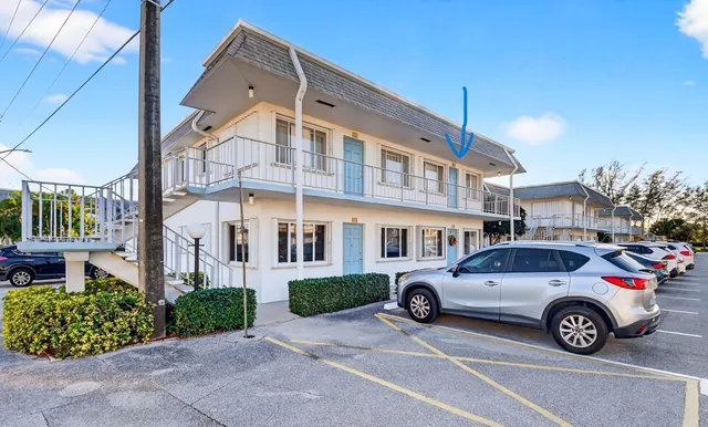 an aerial view of a city with ocean view