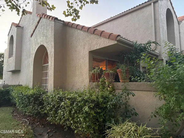an outdoor view of house and garden