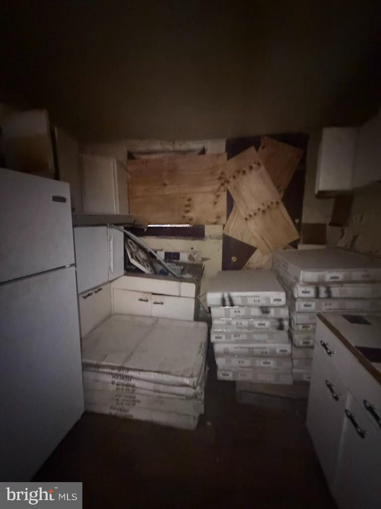 1612 Lemmon Street Baltimore, MD 21223 - Photo 7 of 20 a view of storage and utility room with washer and dryer