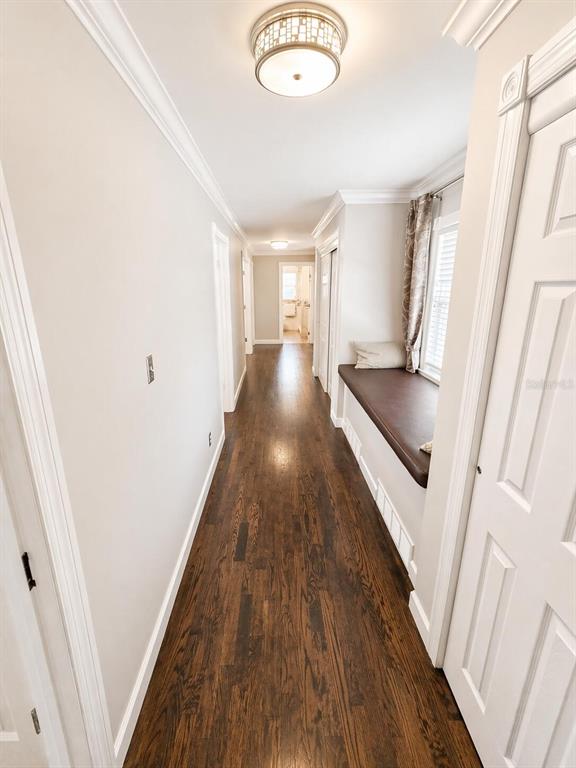 2313 Southeast 7th Street Ocala, FL 34471 - Photo 29 of 54 a view of a hallway with wooden floor and staircase