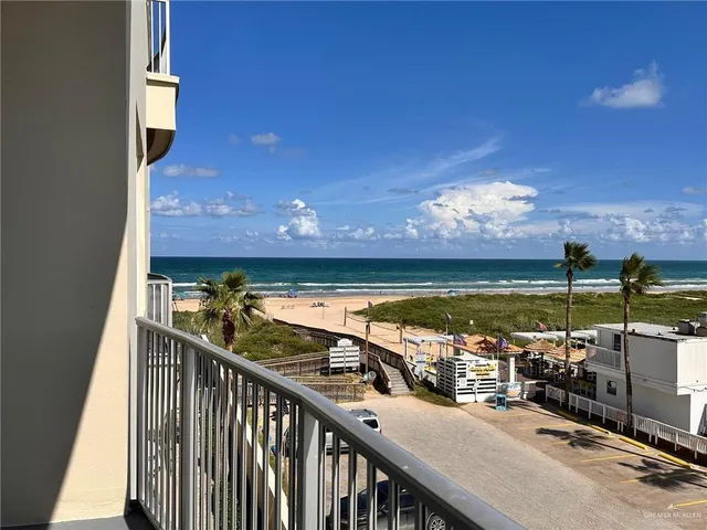 a view of a balcony with an ocean