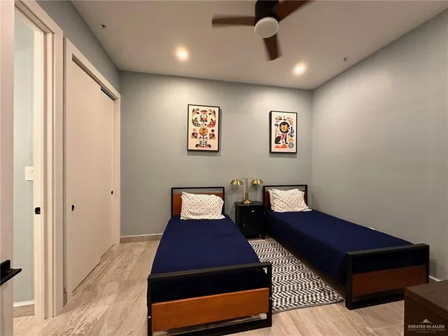 a bed room with a bed and a walk in closet