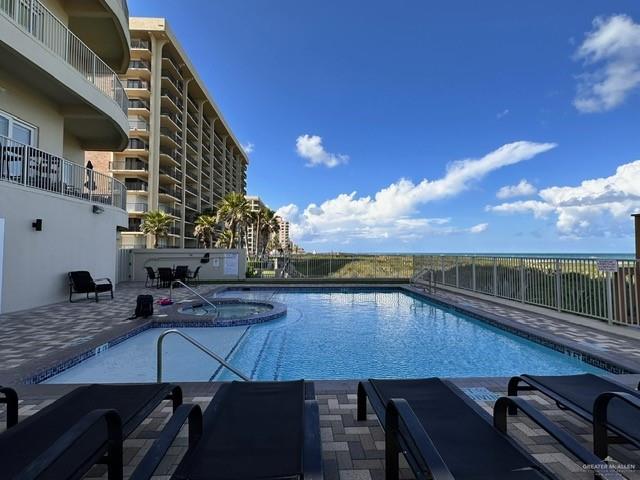 2700 Gulf Boulevard, Unit 204 South Padre Island, TX 78597 - Photo 24 of 31 a terrace with outdoor seating and city view