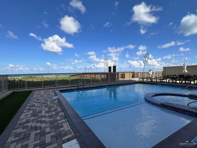2700 Gulf Boulevard, Unit 204 South Padre Island, TX 78597 - Photo 26 of 31 a view of a swimming pool and an outdoor seating