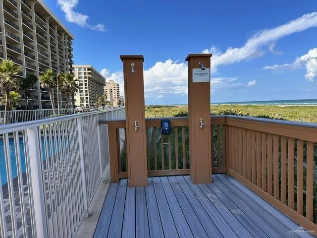 a view of a balcony with wooden floor