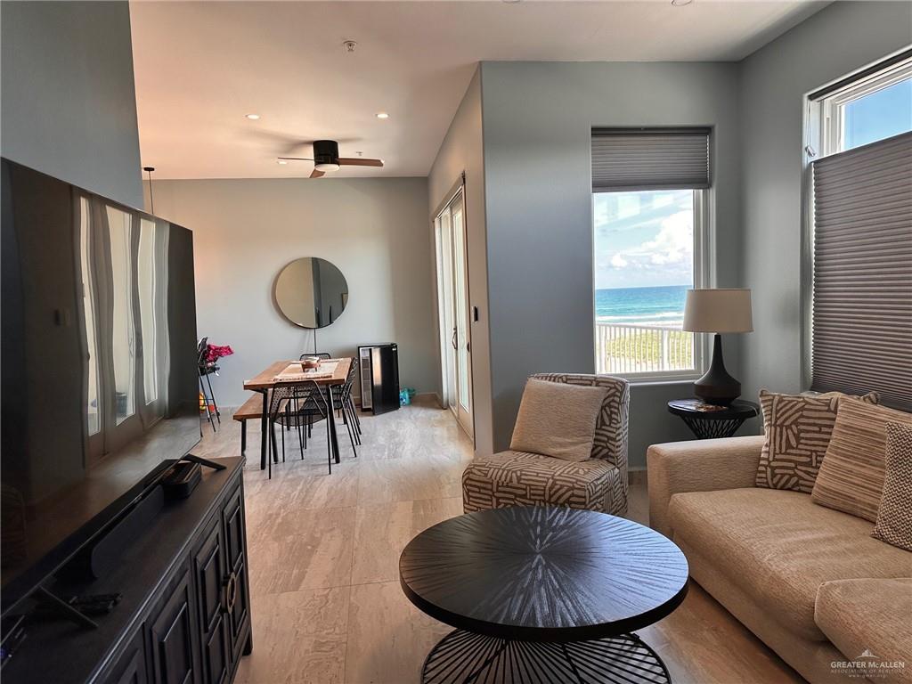 2700 Gulf Boulevard, Unit 204 South Padre Island, TX 78597 - Photo 6 of 31 a living room with furniture and a large window