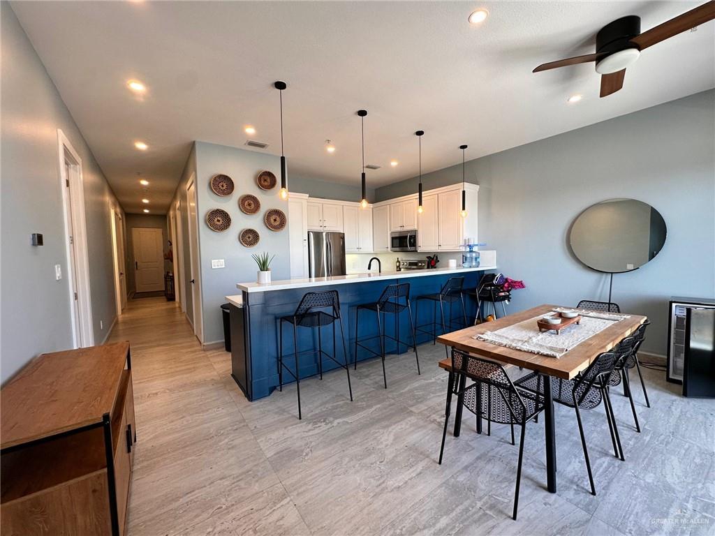 2700 Gulf Boulevard, Unit 204 South Padre Island, TX 78597 - Photo 7 of 31 a large kitchen with a table and chairs