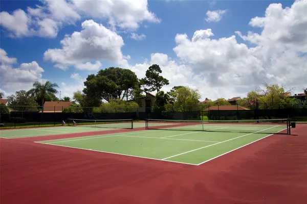 a view of an outdoor space and tennis court