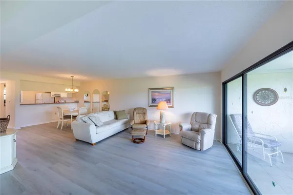a living room with fireplace furniture and a wooden floor