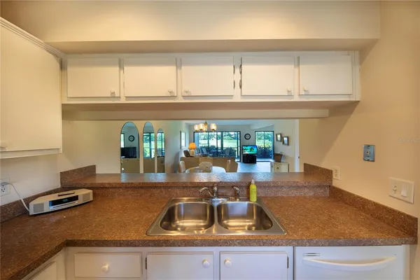 a kitchen with a sink and a counter top space