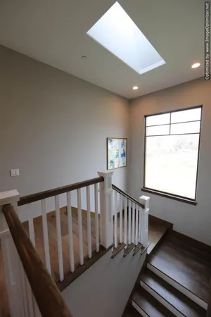 a bedroom with a bed and wall painting