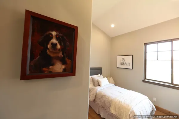 a spacious bathroom with a double vanity sink toilet and a mirror