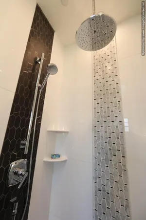 a bedroom with a bed and a potted plant