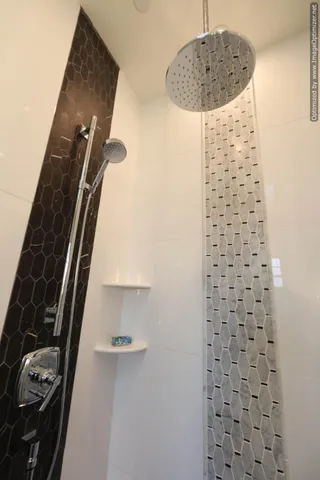 a bedroom with a bed and a potted plant