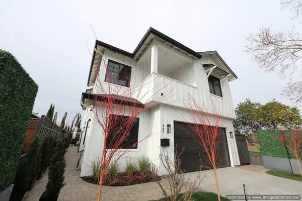 a view of a house with a parking space