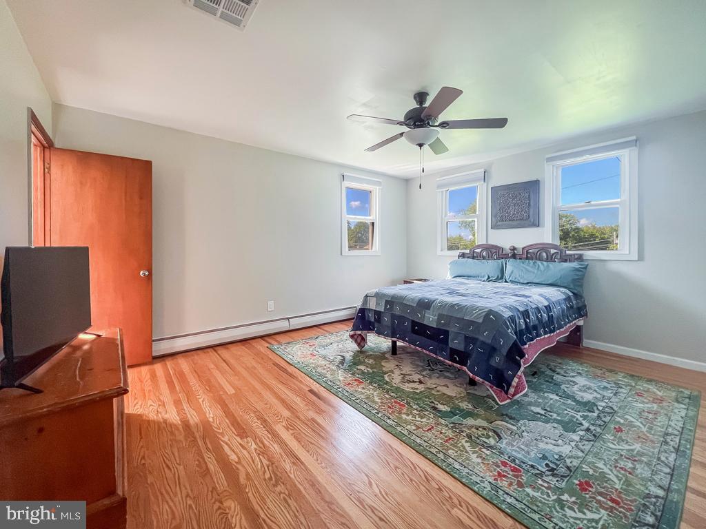 4643 Lerch Road Bensalem, PA 19020 - Photo 19 of 69 a bedroom with a bed and a flat screen tv